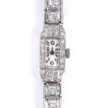 A lady's platinum and diamond encrusted cocktail wristwatch, total diamond content approx 2ct,