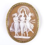 A relief carved cameo shell panel brooch, depicting The Three Graces, in unmarked gold rope twist