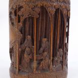 An Oriental bamboo cylindrical pot and cover, the sides decorated with figures in a bamboo forest in