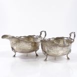 A pair of silver gravy boats, with scalloped rims and hoofed feet, by Adie Brothers Ltd, hallmarks