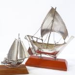 2 silver models of ships, largest height including base 18cm (2)