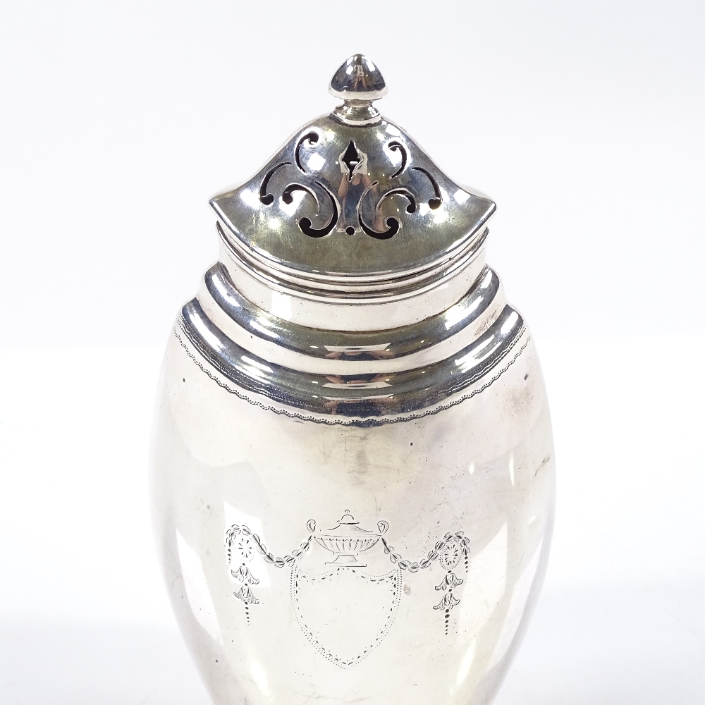 A navette-shaped silver sugar shaker, with Adams style decoration, by Goldsmiths and Silversmiths Co