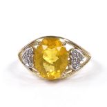 A 9ct gold lemon quartz dress ring, with heart-shaped diamond set shoulders, setting height 11.