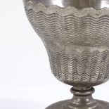 An Islamic unmarked white metal wine goblet, height 12cm, diameter 11cm