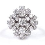 An 18ct white gold diamond cluster cocktail ring, central diamond approx 0.4ct, total diamond