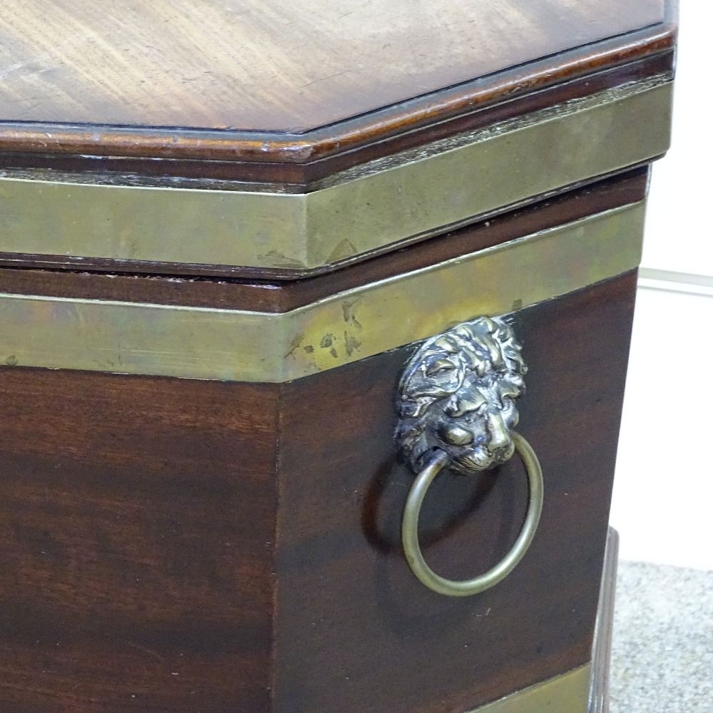 A George III brass-bound mahogany wine cooler of octagonal form, on tapered legs, with brass lion - Image 3 of 8