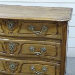 An 18th century French fruitwood serpentine-front 3-drawer commode, with shaped panelled drawer