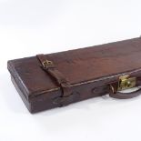 A good quality leather shotgun case with fitted interior, length 71cm