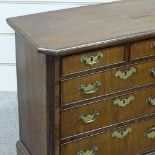 A George III walnut chest of 3 long and 2 short drawers of small size, with fluted canted corners,