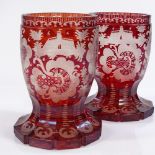 A pair of 19th century Bohemian ruby overlay glass goblets, with engraved decoration, height 12.5cm