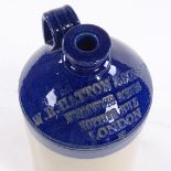 A salt glaze stoneware flagon with impressed text WR Hatton & Sons Wormwood Scrubs Notting Hill