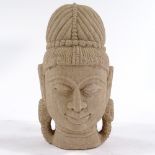 An Indian carved sandstone head, height 16cm