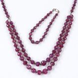 A sterling silver and faceted ruby necklace and bracelet set, necklace length 48cm (2)