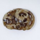 A Chinese carved and pierced jade panel, with dragon decoration, diameter 5.5cm.