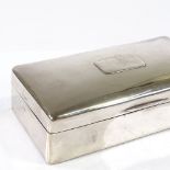 A rectangular silver cigarette box, maker's marks CLS, hallmarks London 1919, length 17.5cm