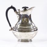 An Edwardian silver hot water jug, of bulbous oval form, by Ollivant & Botsford, hallmarks Sheffield