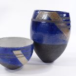 A raku fired bowl and vase with wax resist blue, white and lustre glaze, maker's monogram on base,