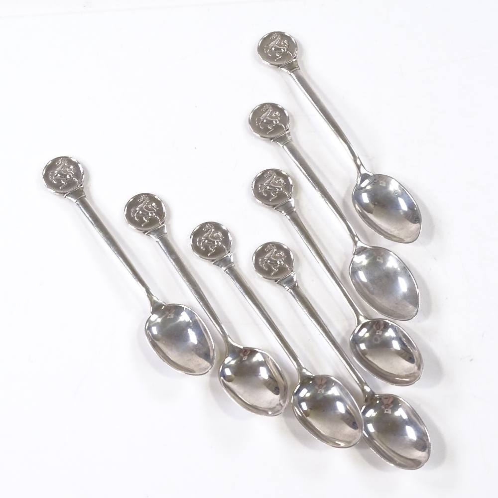 A set of 7 silver teaspoons, with stallion terminals, maker's marks C E, hallmarks London 1934/1935, - Image 2 of 4