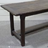 An oak refectory style dining table, with chamfered square legs and stretcher base, 6'5" x 2'5"