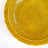 A Chinese yellow glaze porcelain bowl with incised decoration, 6 character mark, diameter 22cm
