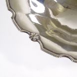 A large circular silver table centre fruit bowl, with scalloped shell edge, by Adie Brothers Ltd,
