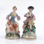 A pair of miniature porcelain figures, gold anchor marks, height 8cm