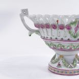 A German porcelain 2-handled bowl with hand painted relief floral decoration, diameter excluding