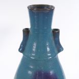 A Chinese turquoise glaze porcelain vase with neck handles, height 39cm