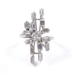 A large 18ct white gold diamond cluster cocktail ring, total baguette and round-cut diamond