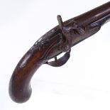 An Antique percussion pistol with carved butt and silver wirework inlay