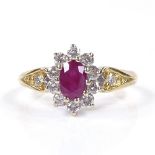 An 18ct gold ruby and diamond cluster ring, with diamond and engraved shoulders, setting height 11.