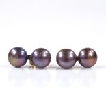 A pair of double black pearl earrings, with unmarked gold stud fittings, height 15.9mm, 2.6g total