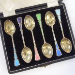 A cased set of silver-gilt and coloured enamel coffee spoons, by Walker & Hall, hallmarks Birmingham