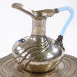 A Continental silver stylised jug and stand, with blue glass handle, by Gurcan, stamped 900, 26.