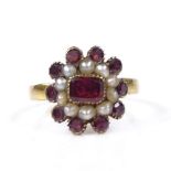 A Victorian unmarked gold garnet and split-pearl cluster ring, setting height 13.3mm, size L, 2.1g