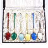 A set of 6 Danish sterling silver-gilt and coloured enamel coffee spoons, with enamelled bowls,