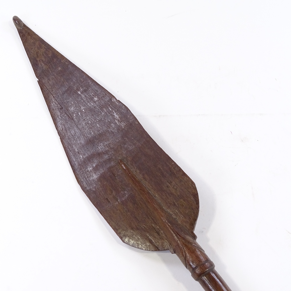 A Papua New Guinea Tribal carved and painted wood ceremonial spear paddle, length 1.3m - Image 3 of 3