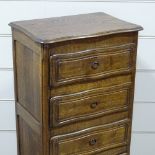 A French narrow oak chest of 4 drawers, with shaped top and carved drawer fronts, width 20.5",