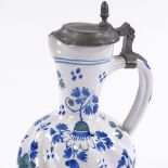 A Continental tin-glazed faience pottery ewer with pewter mounts, height 25cm