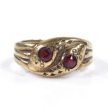 A 9ct gold garnet double snake head ring, setting height 9.7mm, size Q, 2.7g