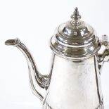 An Edwardian silver coffee pot, of tapered cylindrical half-fluted form, hallmarks London 19074,
