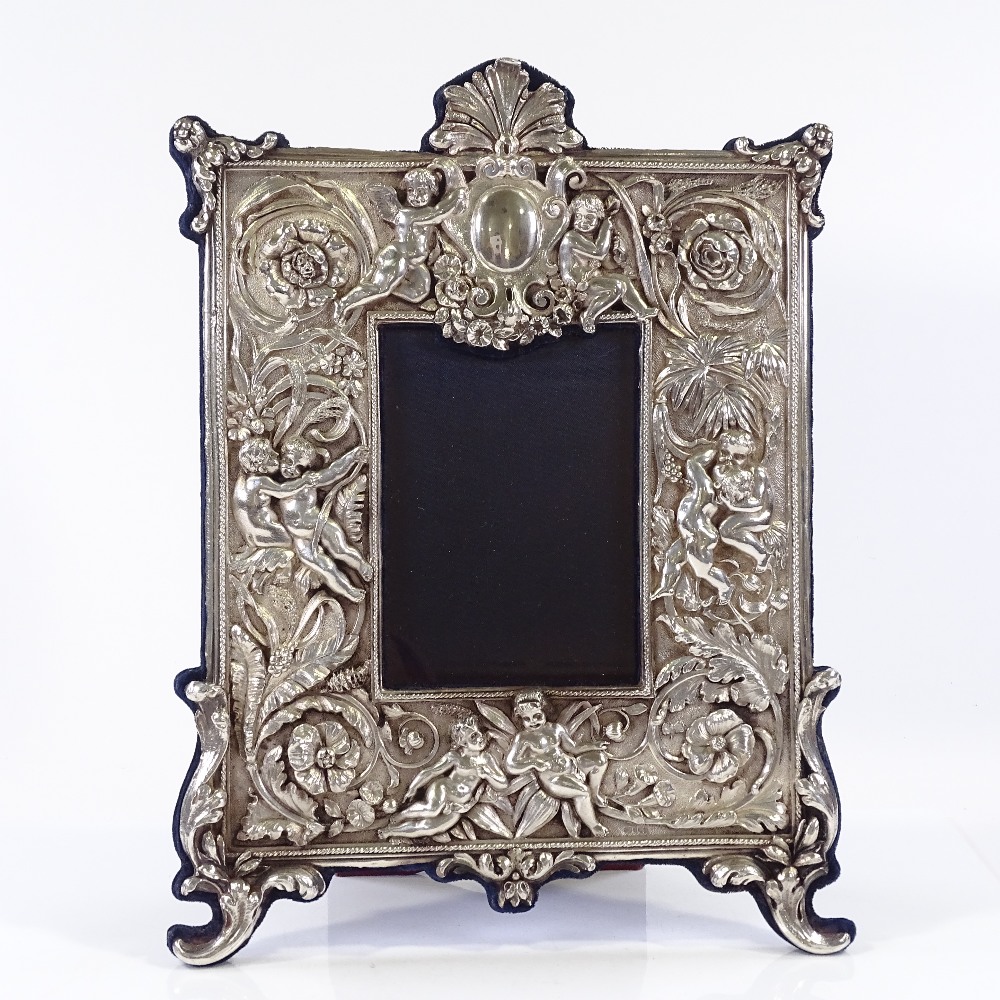 A modern Britannia standard silver-fronted photo frame, with high relief flower and cherub - Image 2 of 4