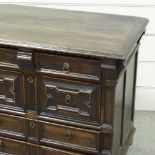 A Jacobean joined oak chest of 4 long drawers, with fielded moulded drawer fronts, and walnut or