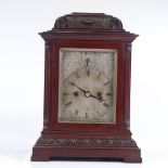 An Edwardian mahogany-cased bracket clock, carved case with engraved silvered dial, retailed by