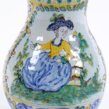 An Antique Continental faience pottery jug, hand painted polychrome decoration, height 20cm