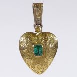 A Victorian unmarked gold and emerald heart-shaped mourning pendant, with foliate engraved