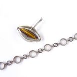 A Finnish sterling silver and tiger's eye stylised pendant, by Kupittaan Kulta Oy, together with a