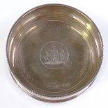 A large silver wine coaster, commemorating the marriage of His Royal Highness The Prince Andrew with