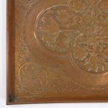 A Keswick School of Industrial Arts copper tray with relief embossed floral designs, 43cm x 36cm