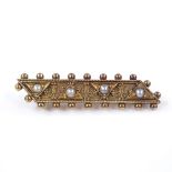 A Victorian unmarked gold and split-pearl memorial brooch, with bead edge and dated 1886, length